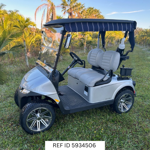2026 E-Z-GO RXV Freedom Elite golf cart in platinum with 14-inch wheels, premium seats, windshield, and Samsung Lithium battery