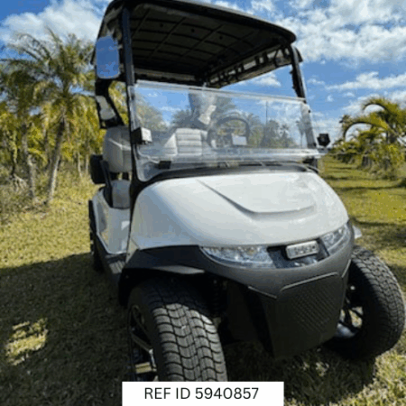 2026 E-Z-GO RXV Freedom Elite golf cart with carbon fiber steering wheel and Sunbrella enclosure