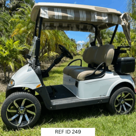 2020 white E-Z-GO RXV Elite golf cart with 14-inch wheels, premium seats, and Sunbrella enclosure