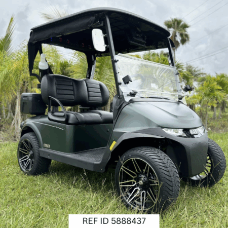 2026 E-Z-GO RXV Elite in matte green parked on a South Florida golf course near palm trees and fairways