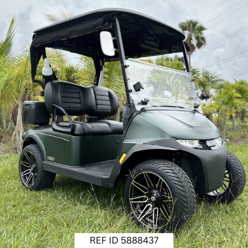 2026 E-Z-GO RXV Elite in matte green parked on a South Florida golf course near palm trees and fairways