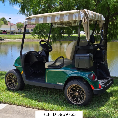 Side angle of 2026 E-Z-GO RXV2 Elite in green parked near palm trees in South Florida