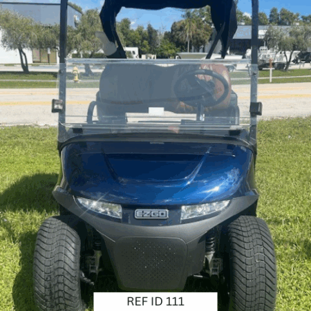 Front view of 2026 E-Z-GO RXV2 ELiTE golf cart in blue with custom wheels, shown at Sunshine Golf Car in South Florida.